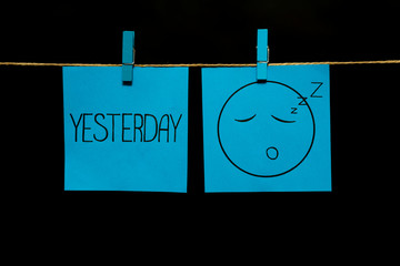 Emotion. Two stickers. Yesterday. On the right on the azure sheet face with a deep sleep expression.