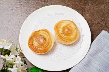 Crisp and tender cream buns in a white dish
