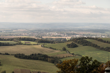 Fototapeta na wymiar Pribor city with meadows, fields and smaller hills around in Czech republic