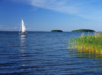 Sniardwy Lake, Masuria region (Mazury), Poland - July, 2005: sailboat on Sniardwy lake - obrazy, fototapety, plakaty