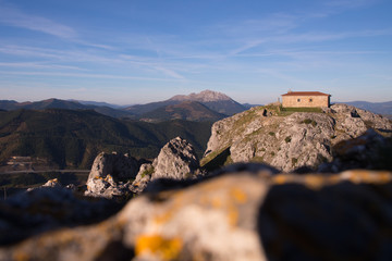 Fototapeta na wymiar Ermitage of Aitzorrotz at the top of the rock in Eskoriatza, Basque Country.