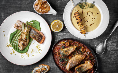 Three-course fish platter Pike perch, salmon steak, Stewed perch.. Dietary menu. Fish menu. Seafood. Concept of healthy food.