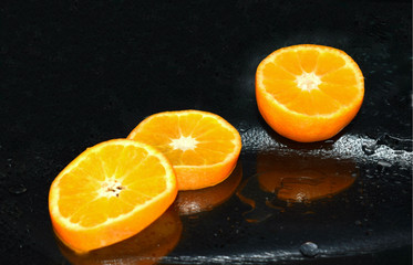 Fototapeta na wymiar orange on black background
