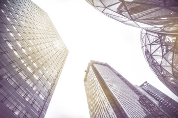 Looking up at Seattle skyscrapers at sunset, color toning applied