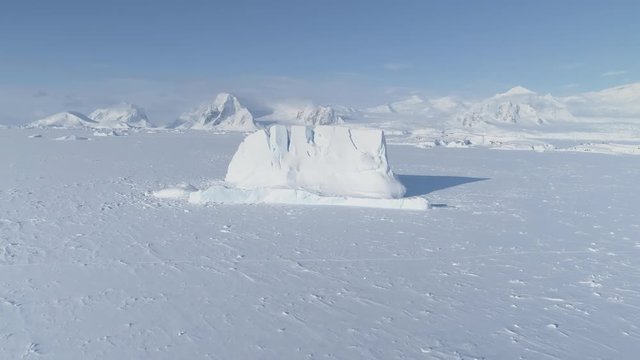 Iceberg Stuck Frozen Antarctic Ocean Water Aerial. Antarctica Winter Wildlife Nature Majestic Landscape. South Pole Frost Up Coast Glacier Drone Flight Footage Shot in 4K (UHD).