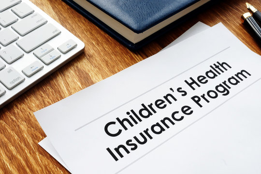 Childrens Health Insurance Program CHIP documents on a desk.