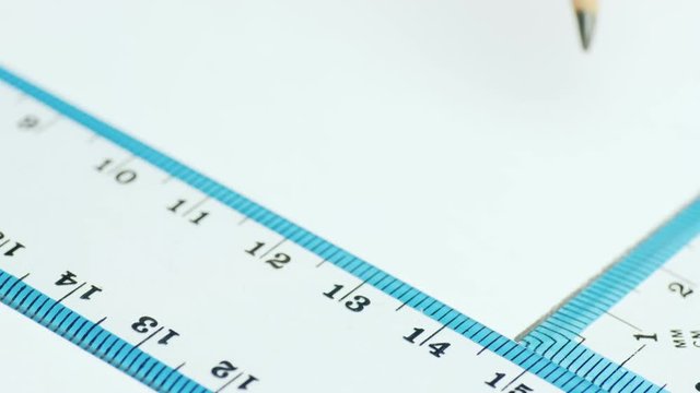 The engineer draws parallel lines in the drawing with a ruler and a triangle. Design concept