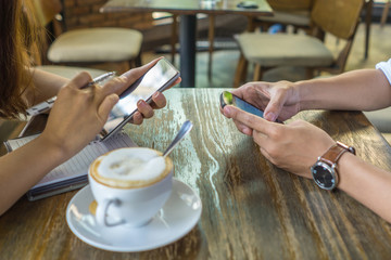 Fototapeta na wymiar People using smart smartphone instead of talking to each other