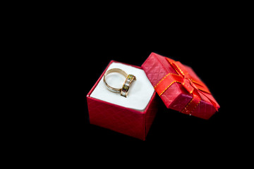 Wedding rings in gift box isolated on black