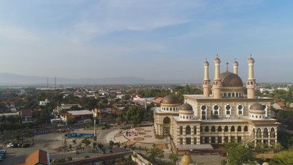 Fototapeta na wymiar beautiful mosque with minarets on island Java Indonesia. aerial view mosque in an asian city