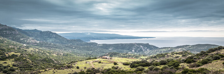 Fototapeta na wymiar Panorama of the mountains and ocean at North Eastern coast of Sardinia, Italy