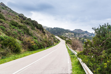 Mountain coast road betrween Bosa and Algharo in Sardinia, Italy