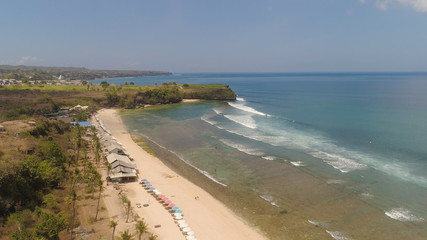 aerial view coastline with sandy tropical beach Balangan. seascape ocean surf and tropical beach large waves turquoise water crushing on shore, Bali,Indonesia. Travel concept.