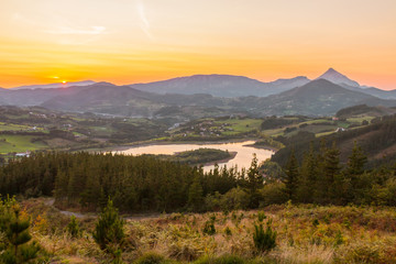 Fototapeta na wymiar Urkulu reservoir and its rural area, in Aretxabaleta, Basque Country.