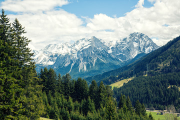 Fototapeta na wymiar View of the majestic Zugspitze mountain from the alp meadows of Lähn, Tyrol, Austria.