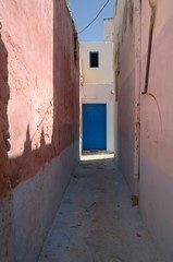 Blue door in alley  in Asilah, Morocco
