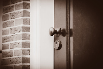 Old door knob in dutch village. Netherlands . Image in sepia color style