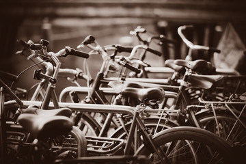 a lot of bikes on parking in Amsterdam, Netherlands . Image in sepia color style
