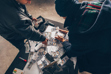 Men in black counting money