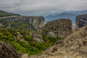 panorama landscape pilgrim and travel touristic site concept photography of beautiful scenic view to steep rocks in south Europe district in Greece with monastery on top of mountains