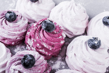 Delicious marshmallow with berries on a grey background. homemade marshmallow, holiday sweets