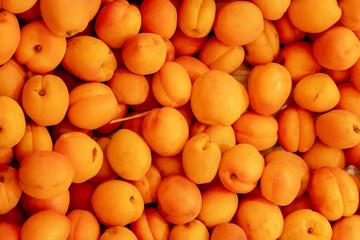 Orange Color Plums In Box Top View