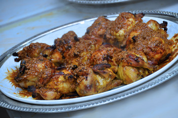 Moroccan grilled chicken. Served with lemon in a traditional Moroccan dish. The main meal at the wedding