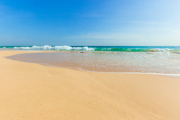 Untouched tropical beach in Sri Lanka with white sand and blue water