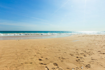 Untouched tropical beach in Sri Lanka with white sand and blue water