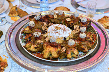 Moroccan grilled chicken. Served with lemon in a traditional Moroccan dish. The main meal at the wedding