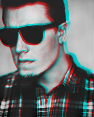 Anaglyph effect of young man in sunglasses.