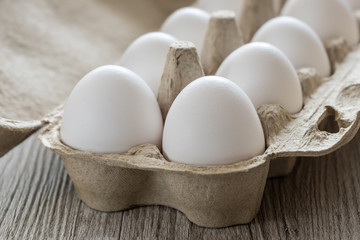 White chicken eggs close up.