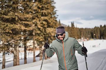 cross country skier enjoying beautiful nature. out in the woods