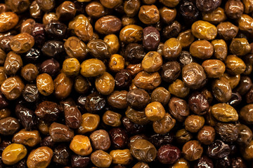 dried olives on the counter of the supermarket