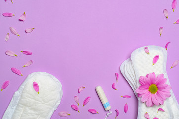 Obraz na płótnie Canvas Woman's Sanitary Pad and Tampon with Gerbera Daisy Flower, Feminine Hygiene Concept