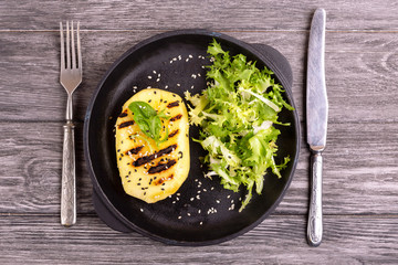 Vegetarian salad with grilled mango, fresh frisee and sesame