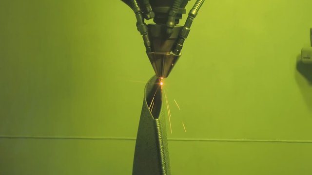 3D metal printer produces a steel part.
