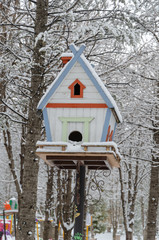 Wooden birdhouse in the park.