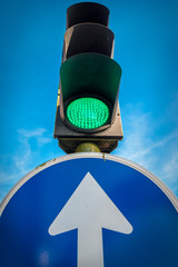 isolated traffic light with sky background and traffic signal