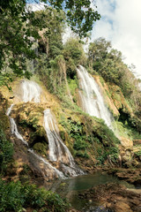 Fototapeta na wymiar Waterfall cascades in tropical forest