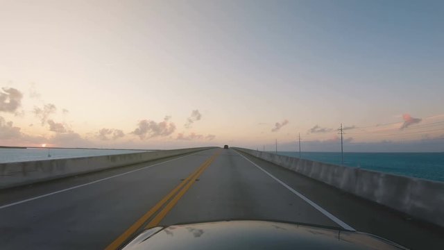 Driving on Overseas Highway Bridge Florida Keys on sunset. POV