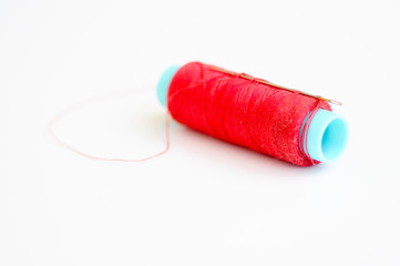 Needle and red thread