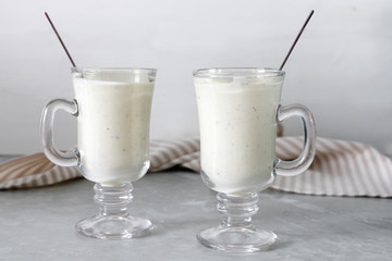 Fresh blended  kiwi protein smoothie with yogurt or milk in glass jar, healthy eating