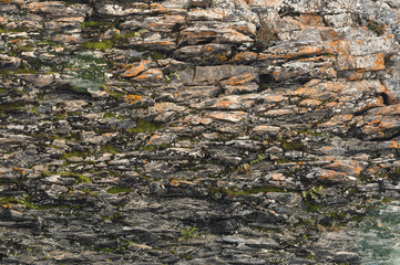 Textured basalt background thin stone fibers in the cut. natural volcanic formations