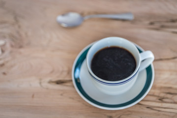 Aerial view of a cup of coffee with a spoon