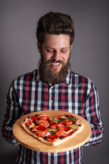 Man holding pizza