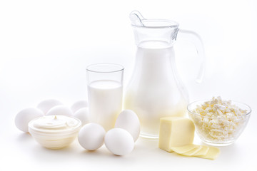 Milk, cottage cheese, sour cream, cheese, butter, eggs, still life from fresh dairy products. The usefulness of milk, dairy products from milk for adults and children.