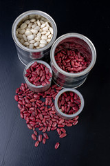 Tasty bean in a metal can on a wooden table. Products for preparing meals.