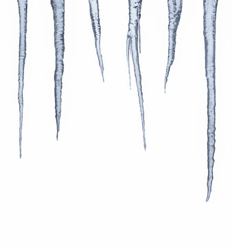 Icicle row isolated on white, ice stalactite