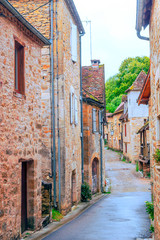 Fototapeta na wymiar Medieval village of Aquitaine with its stone houses in the south of France on a cloudy day.